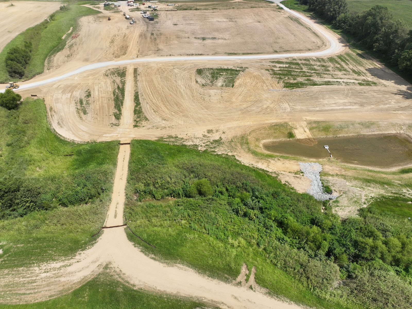 Basin and silt fence line on a phased solar site